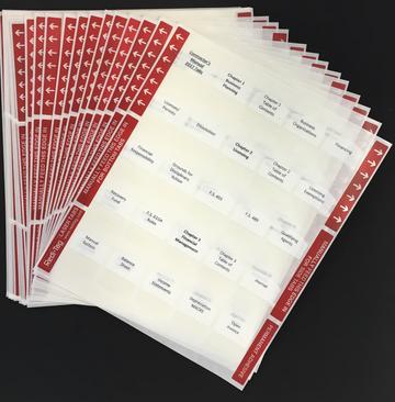 Multiple sheets of preprinted tabs for organizing GITS Trade 2 study materials with red labeled headers on a black background